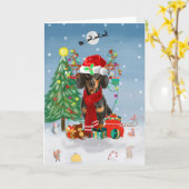 Dachshund Dog in sneeuw met kerstcadeaus Kaart (Gele Bloem)