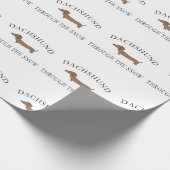 Dachshund door de sneeuw cadeaupapier (Hoek)