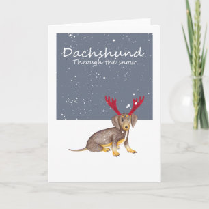 Dachshund door de sneeuw feestdagen kaart
