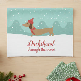 Dachshund door de sneeuwhanddoek theedoek