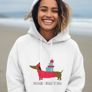 Dachshund door de sneeuwklap met kerstmis hoodie