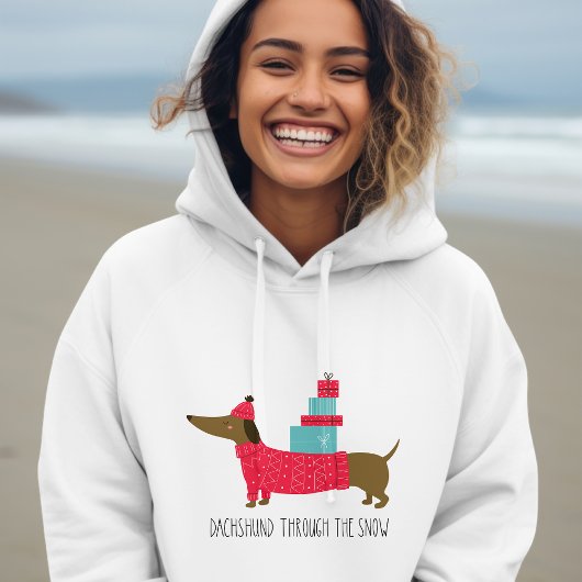 Dachshund door de sneeuwklap met kerstmis hoodie
