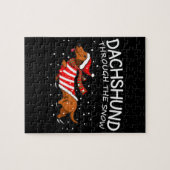 Dachshund door de sneeuwnende hond kerstmis legpuzzel (Horizontaal)