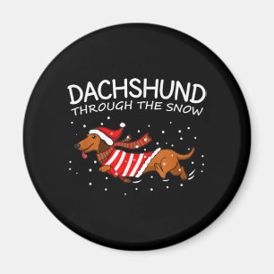 Dachshund door de sneeuwnende hond kerstmis magneet