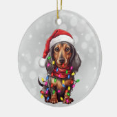 Dachshund hond verpakt in kerstverlichting keramisch ornament (Links)