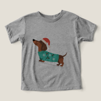 Dachshund met kersttrui en kerstmuts