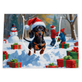 Dachshund Rent in de Sneeuw met Kerstmuts Groot Cadeauzakje (Voorkant)