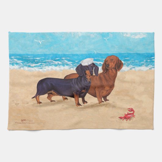 Dachshunds bij de strandlaken theedoek (Horizontaal)