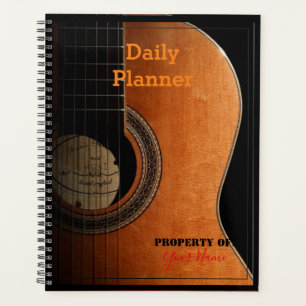Dagelijkse planner met een gitaar op de omslag - H