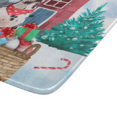 Dalmatische hond in het sneeuwkersthondenhuis snijplank (Hoek)