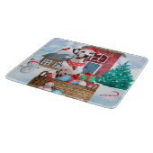 Dalmatische hond in het sneeuwkersthondenhuis snijplank (Hoek)