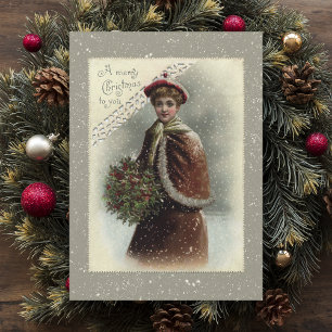  dame in sneeuw met kerstcadeautje feestdagenkaart