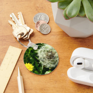 Dandelionbloem en zaadkop sleutelhanger