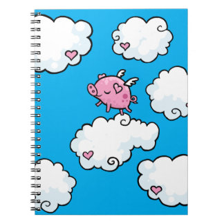Dans van vliegende varkens op het spiraalboek van notitieboek