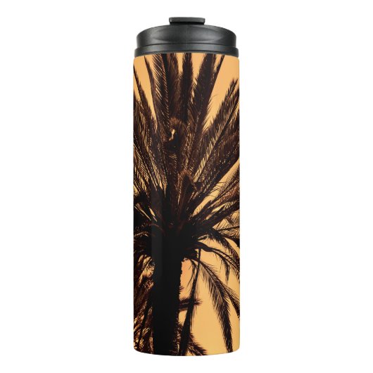 Dark silhouettes of date palms against bright colo thermosbeker (Voorkant)