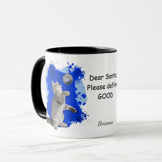 De afspeelbare Kitten heeft de Kerstman nodig om G Mok (Voorkant links)