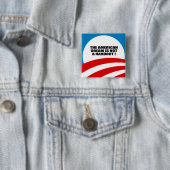 DE AMERIKAANSE DROOM IS GEEN HANDOUT VIERKANTE BUTTON 5,1 CM (In situ)