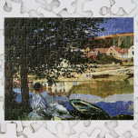 De Bank of the Seine, Bennecourt door Claude Monet Legpuzzel<br><div class="desc">Op de Bank of the Seine is Bennecourt (1869) van Claude Monet een schilderij van de impressionistische kunst van de natuur. Een portret van een vrouw die onder een schaduwboom op de oevers van de Seine-rivier zit. Ze zit in de buurt van boten en rowboten met gebouwen aan de andere...</div>