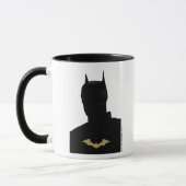 De Batman met het symbool Golden Bat Mok (Links)