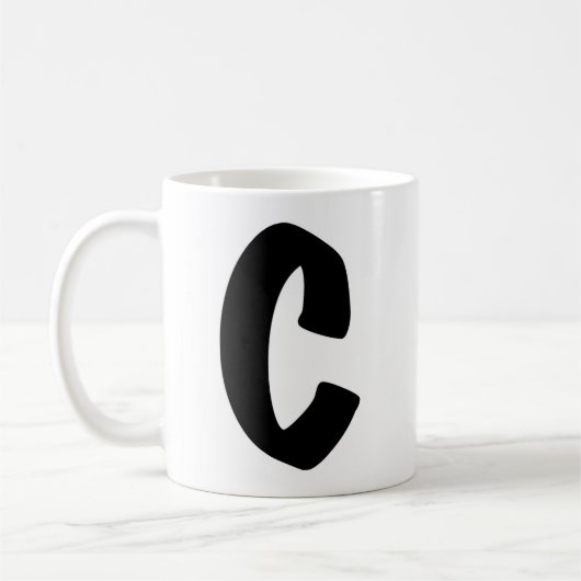 De "C" mok (Links)