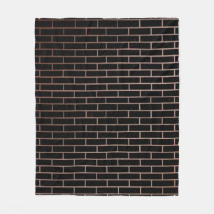De donkere zwarte muur heeft een ruw oppervlak als fleece deken