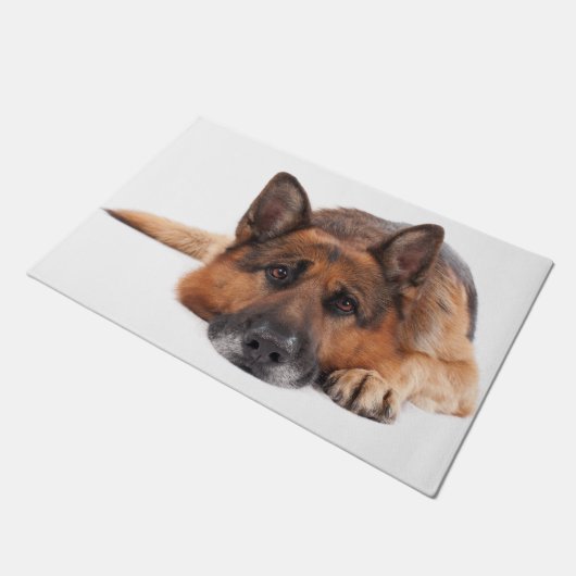 De Duitse herder ligt op een witte achtergrond Deurmat (Schuin)