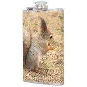 De eekhoorn eet een moerfoto heupfles (Links)