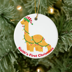 De eerste kerstdinosaurus van baby.  keramisch ornament