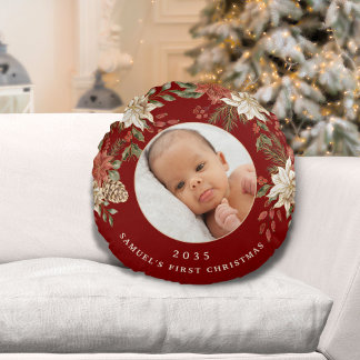 De eerste kerstfoto van een elegante baby rond kussen