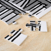 De eigenaar van de boekwinkel neemt stappen van bo legpuzzel (Zijkant)