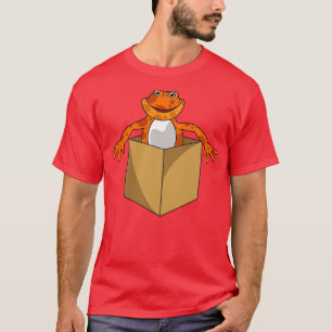 De gekke kikker kijkt uit een doos t-shirt