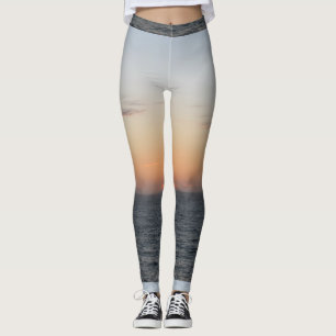 De gloeiende Oranje Leggings van de Zonsondergang