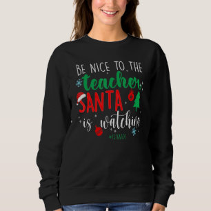 De grappige 1stgrade be Mooie Techer Santa kijkt n Trui