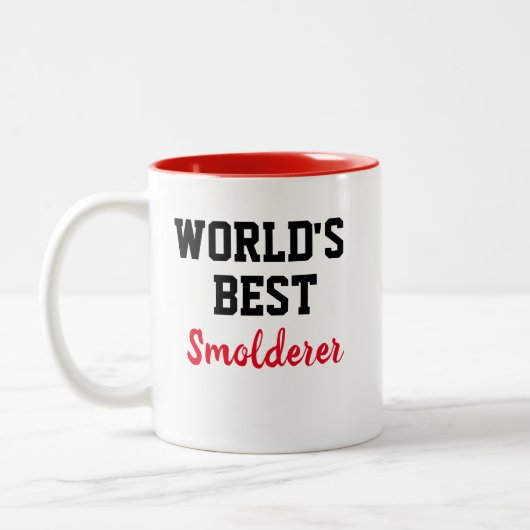 De grappige 'Novelty WORLD' BESTE 'SMOLDERER' Tweekleurige Koffiemok (Links)