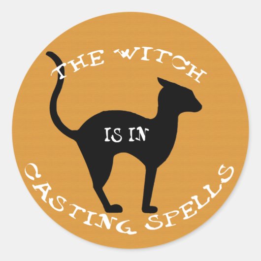De heks zit in ronde sticker (Voorkant)