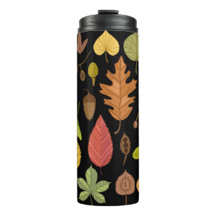 De herfst verlaat vintage die op zwarte achtergron thermosbeker