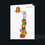 De Herten van de hulst met de kaart van<br><div class="desc">Het Hert van de hulst gebruikt een stapel van wankelend de cadeaus van Kerstmis om Kerstmis te bereiken huidig op een hoge plank.</div>