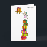 De Herten van de hulst met de kaart van<br><div class="desc">Het Hert van de hulst gebruikt een stapel van wankelend de cadeaus van Kerstmis om Kerstmis te bereiken huidig op een hoge plank.</div>