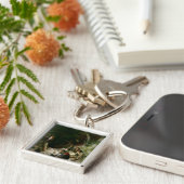 De hinderlaag sleutelhanger (Zijkant)