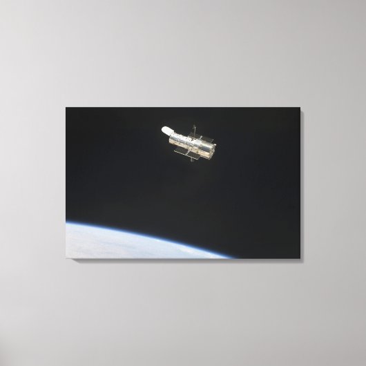 De Hubble Ruimtetelescoop in een baan boven Aarde Canvas Afdruk (Voorkant)