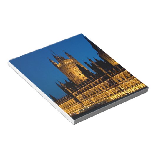 De huizen van het Parlement 's nachts in de stad Notitieblok (Schuin)