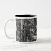 De jonge erfgenaam is in het bezit van tweekleurige koffiemok (Links)