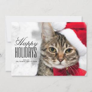 De kat van Kerstmis bij het pet van rode santa Feestdagenkaart