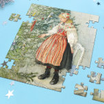 De kerstboom versieren - Carl Larsson Legpuzzel<br><div class="desc">Zweedse kunst door kunstenaar Carl Larsson. Een blond meisje in traditionele jurk staat op een stoel om de kerstboom te versieren. Zie winkel voor het coördineren van objecten! Over de kunstenaar: Carl Larsson was Zweeds schilder, illustrator, graficus en schrijver. Hij wordt nu vooral herinnerd aan zijn waterverven van het idyllische...</div>