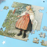 De kerstboom versieren - Carl Larsson Legpuzzel<br><div class="desc">Zweedse kunst door kunstenaar Carl Larsson. Een blond meisje in traditionele jurk staat op een stoel om de kerstboom te versieren. Zie winkel voor het coördineren van objecten! Over de kunstenaar: Carl Larsson was Zweeds schilder, illustrator, graficus en schrijver. Hij wordt nu vooral herinnerd aan zijn waterverven van het idyllische...</div>