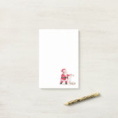 De kerstman controleert zijn lijst van Nice Post-it® Notes (Op bureau)