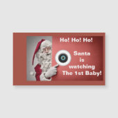 De kerstman kijkt naar de eerste baby magneet (Voorkant)