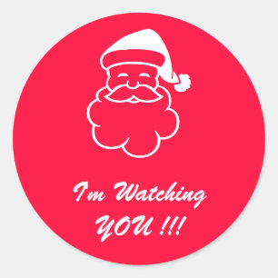 De kerstman kijkt naar jou. ronde sticker