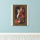 De kerstman leest zijn lijst van goede kinderen canvas afdruk (Insitu (Houten vloer))