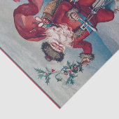 De kerstman op een rendiertje achter de rug. tissuepapier (Detail)